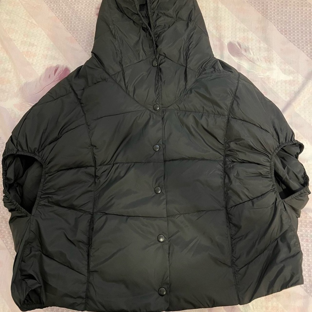 Black poncho. Fits a small.